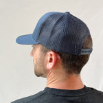 Load image into Gallery viewer, Nisos Trucker Hat in Navy
